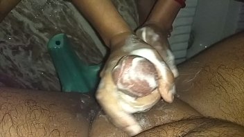 Sexy indian wife giving handjob to hubby while bathing
