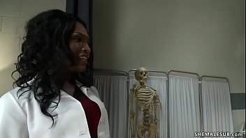 Pervy tall ebony shemale doctor Chanel Couture with big tits and big black cock strips to stockings and fucks her patient Marcelo up his ass