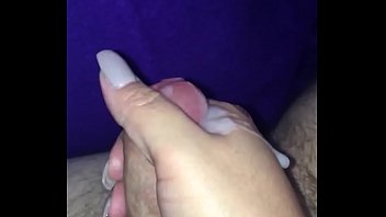 Handjob after sex. Under a blanket with family nearby